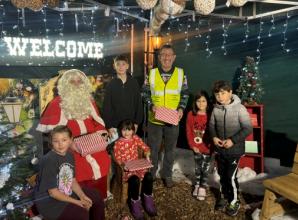 Children receive presents from special needs charity