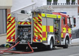 Firefighters from three counties still 'checking for hotspots' after Burnham roof fire