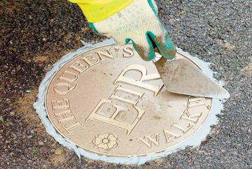 Gunmetal markers line The Queen's Walkway route around Windsor