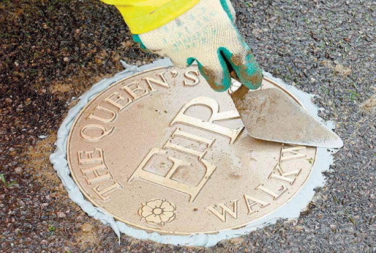 Gunmetal markers line The Queen's Walkway route around Windsor
