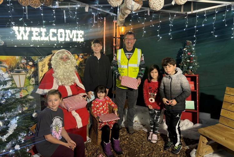 Children receive presents from special needs charity